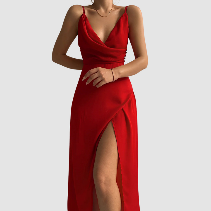 Bold red dress with a draped bodice and thigh-high slit, showcased in a studio setting.