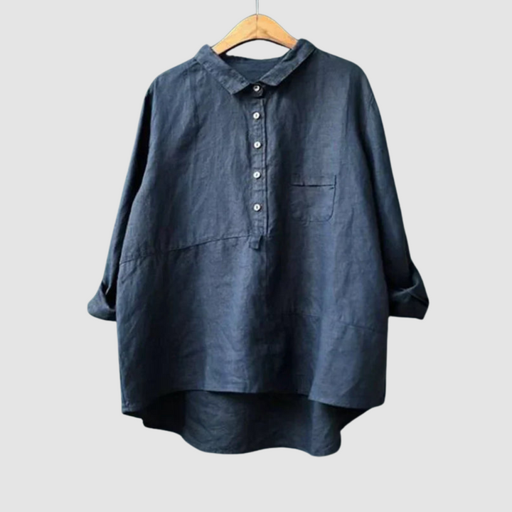Dark navy blouse on hanger with rolled sleeves, button-down front, and chest pocket against a light gray background.