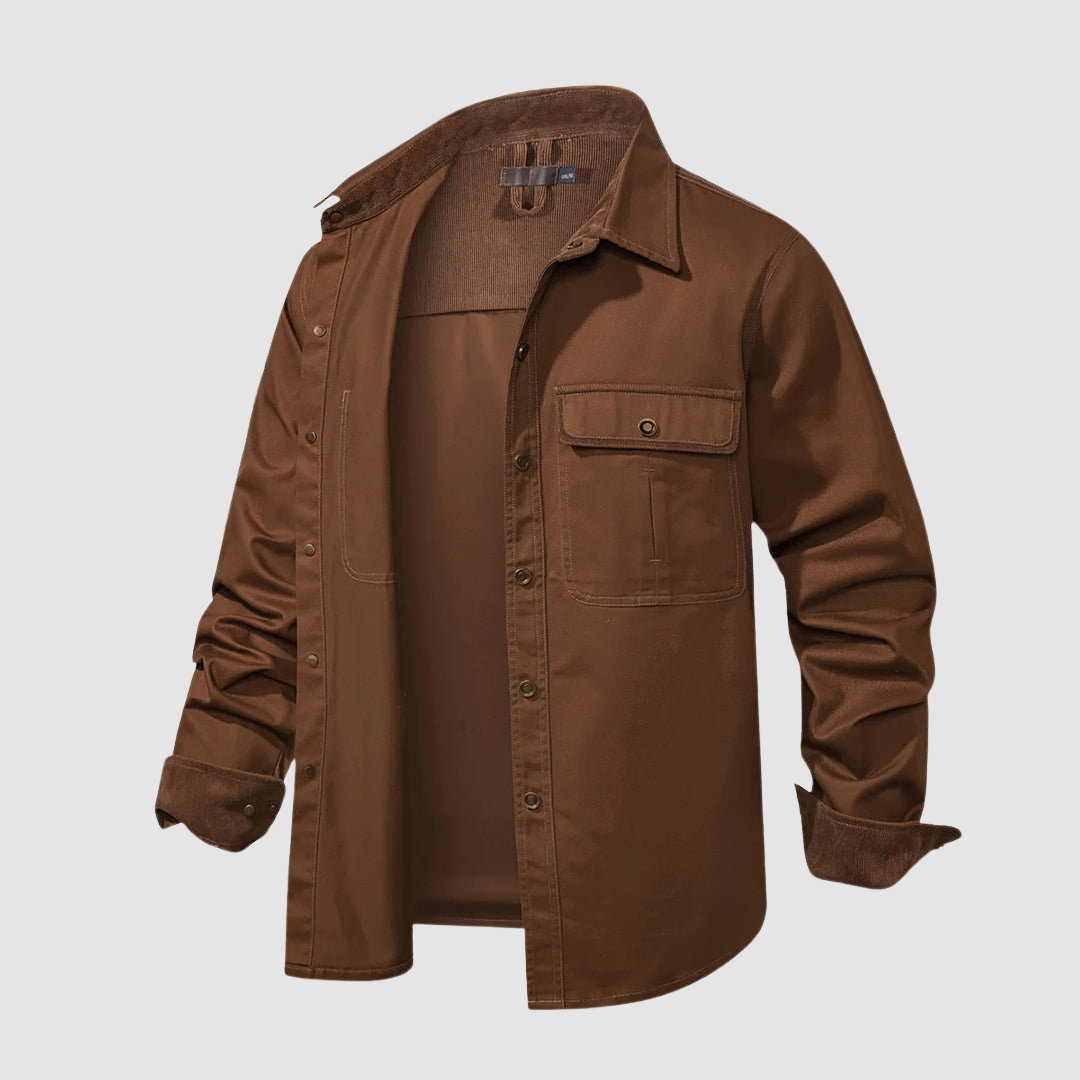 Brown shirt partially open, dark brown inner collar, pocket detail, studio setting.
