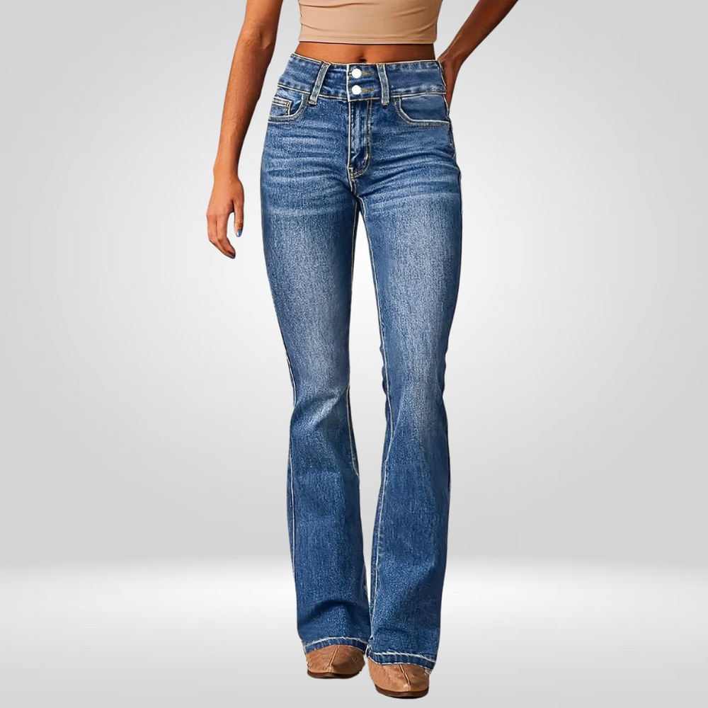 Front view of high-flared blue jeans worn by a model in a studio.