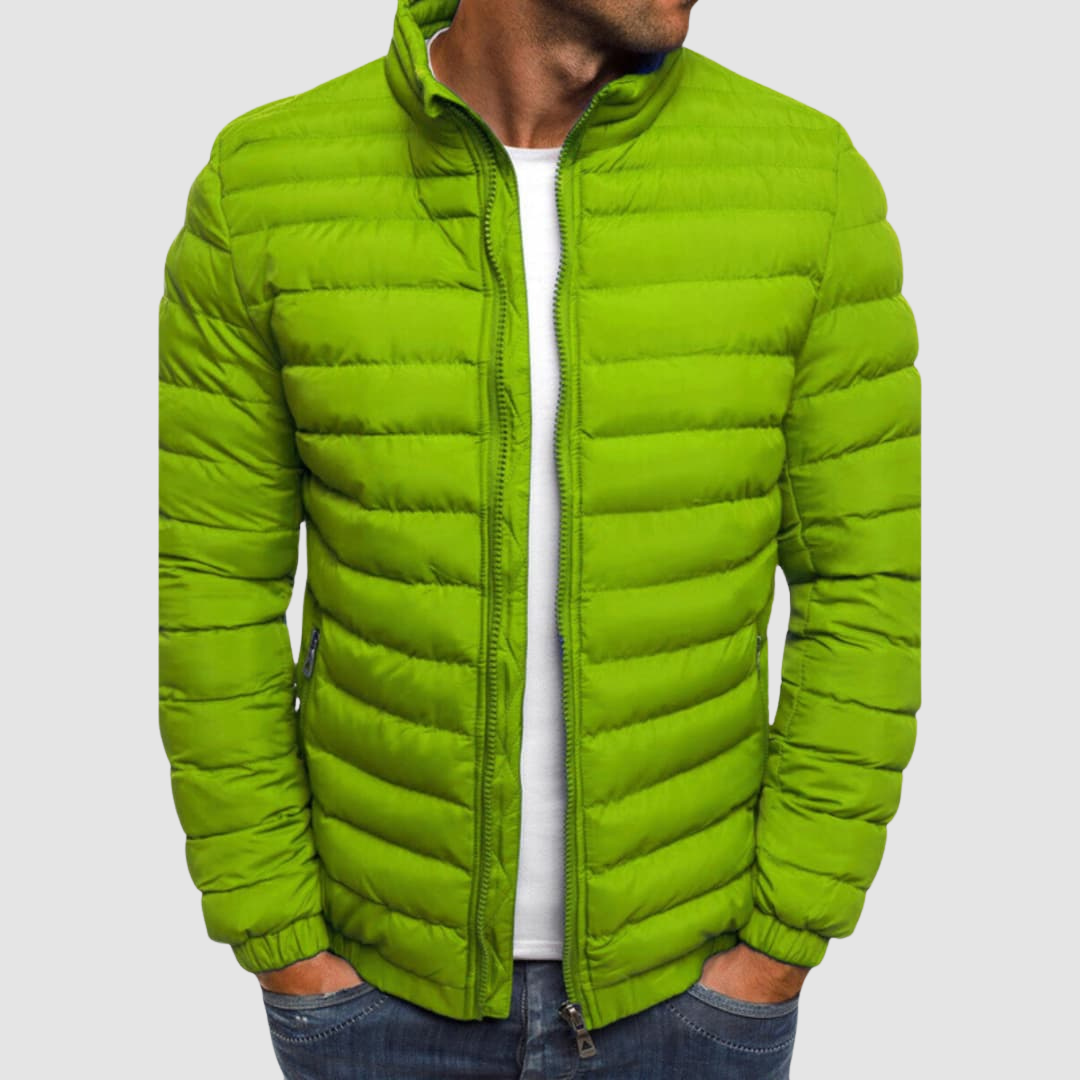 Green lightweight summer jacket with a front zipper, modeled with hands in pockets against a plain background.