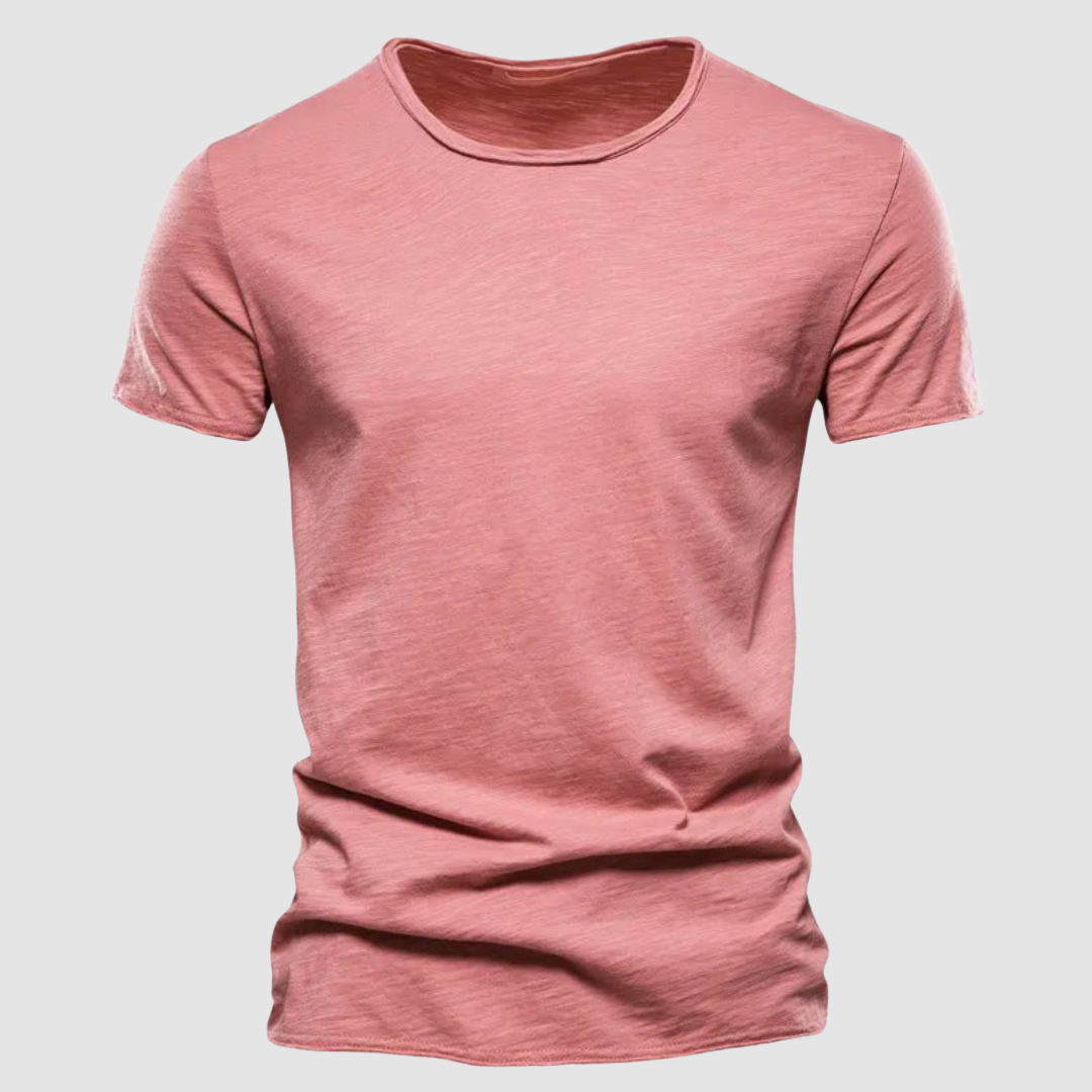 Pink short-sleeve t-shirt with a round neck on a plain background.