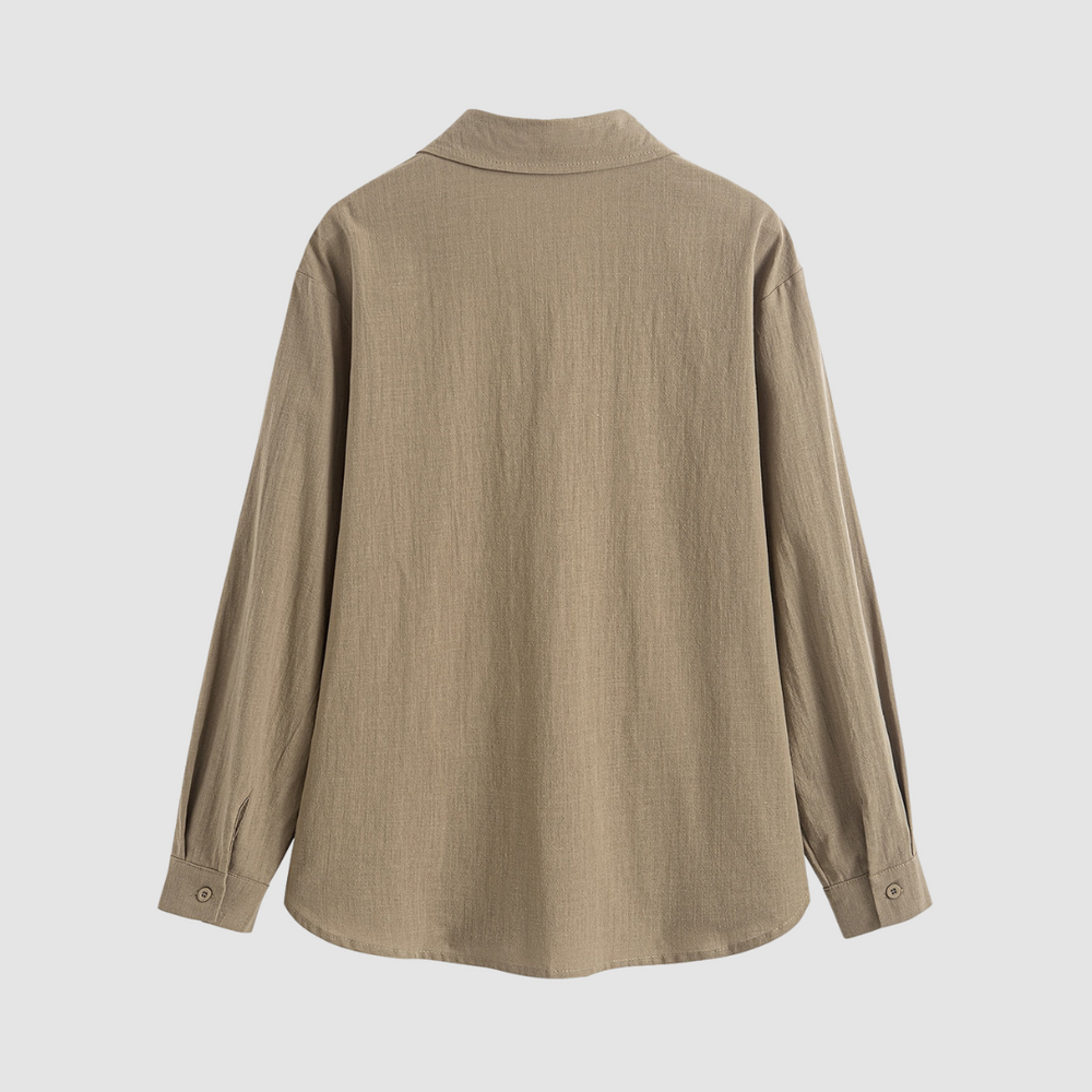 Back view of a soft, classic pocket blouse in beige, shown on a white backdrop.
