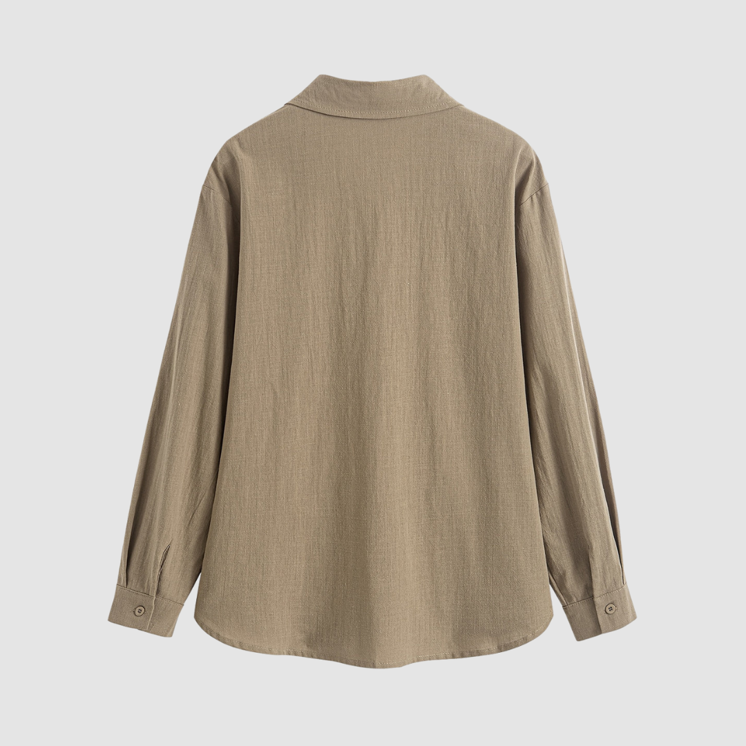 Back view of a soft, classic pocket blouse in beige, shown on a white backdrop.