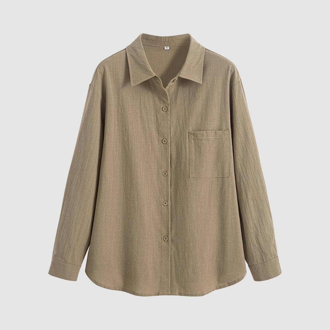Front view of a soft, classic pocket blouse in a neutral beige color, displayed on a white background.