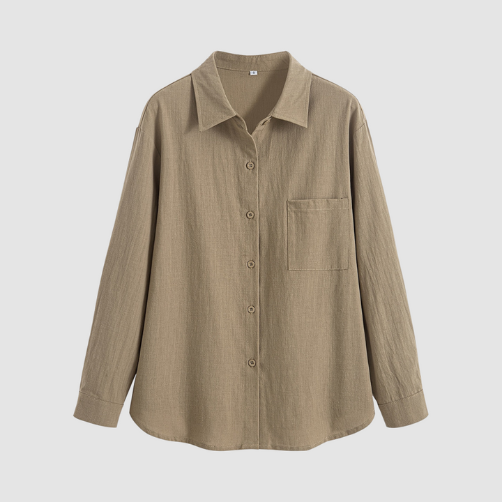 Front view of a soft, classic pocket blouse in a neutral beige color, displayed on a white background.