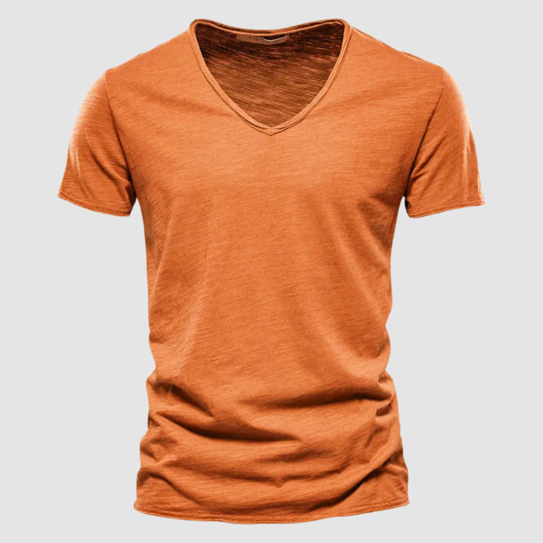 Orange V-neck summer tee with short sleeves in a studio setting.
