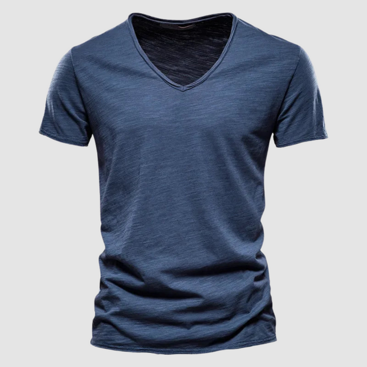 Slate blue V-neck summer tee with short sleeves in a studio setting.