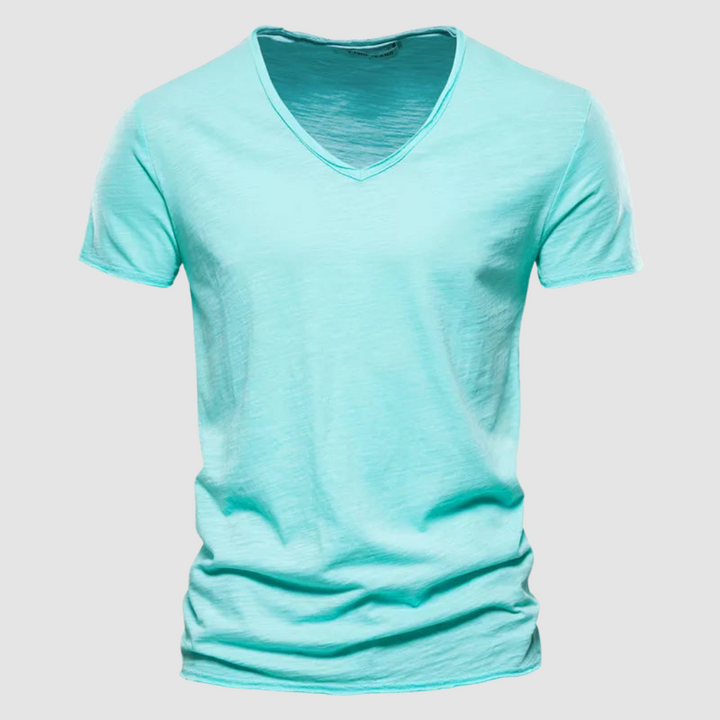 Mint green V-neck summer tee with short sleeves in a studio setting.