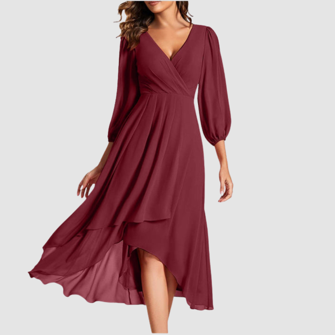 Elegant V-neck long dress in rich burgundy, with flowing layers and three-quarter sleeves, studio setting.