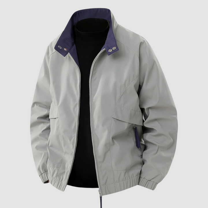 Light gray casual spring jacket with navy collar detail, front view, on a plain gray background.