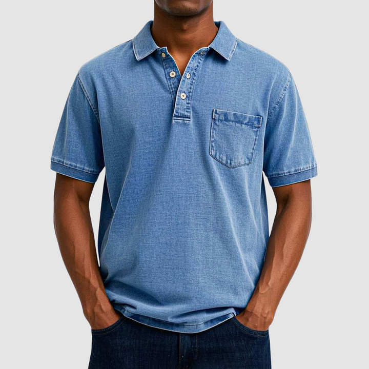 Blue casual polo shirt with short sleeves and buttoned collar, worn by a model in a studio setting.