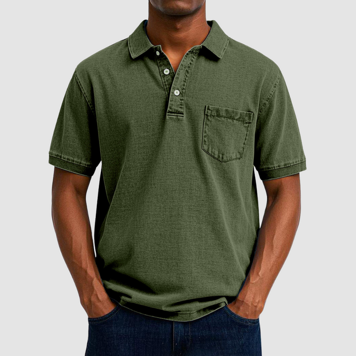 Olive green casual polo shirt with short sleeves and buttoned collar, shown on a model in a studio.