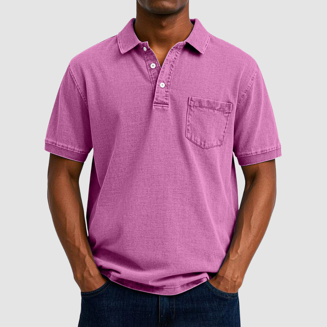 Pink casual polo shirt with short sleeves and buttoned collar, modeled by a person in a studio setting.