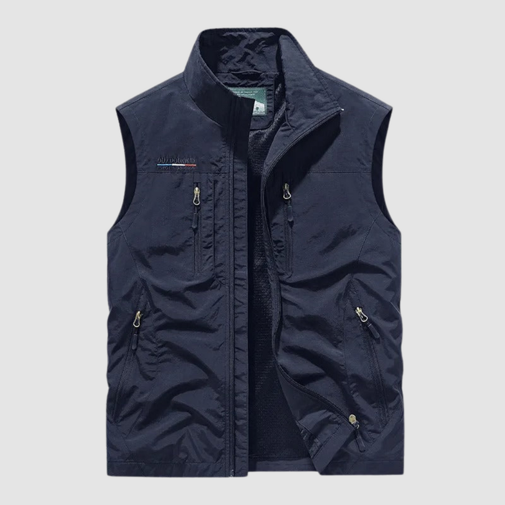 Dark blue breathable utility vest with zipper pockets on a light gray background.