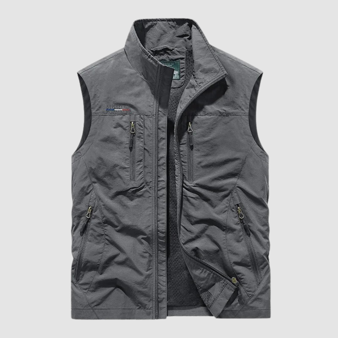 Gray breathable utility vest with zipper pockets on a light gray background.