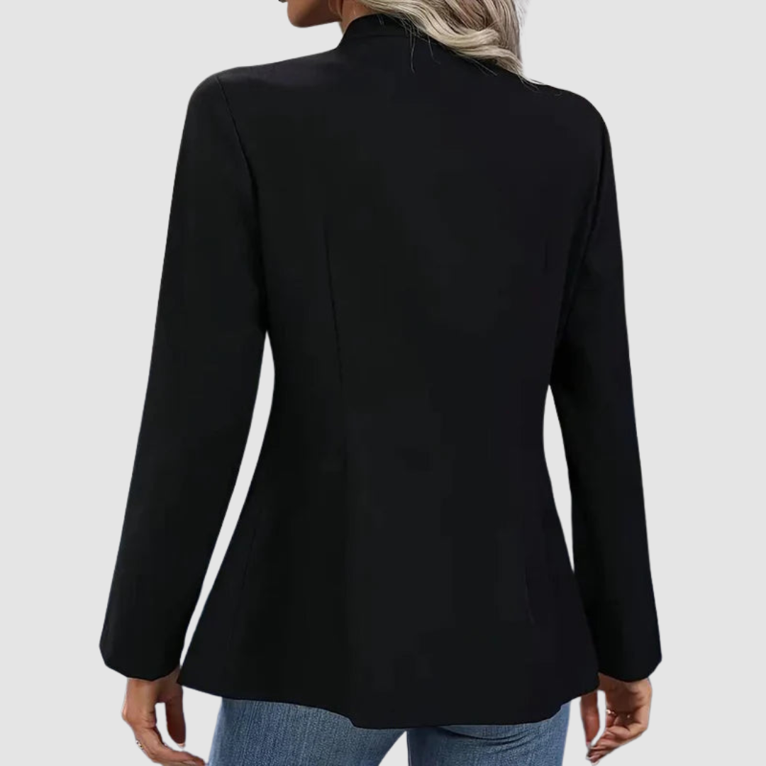 Rear view of black blazer with structured fit, presented in a neutral studio environment.