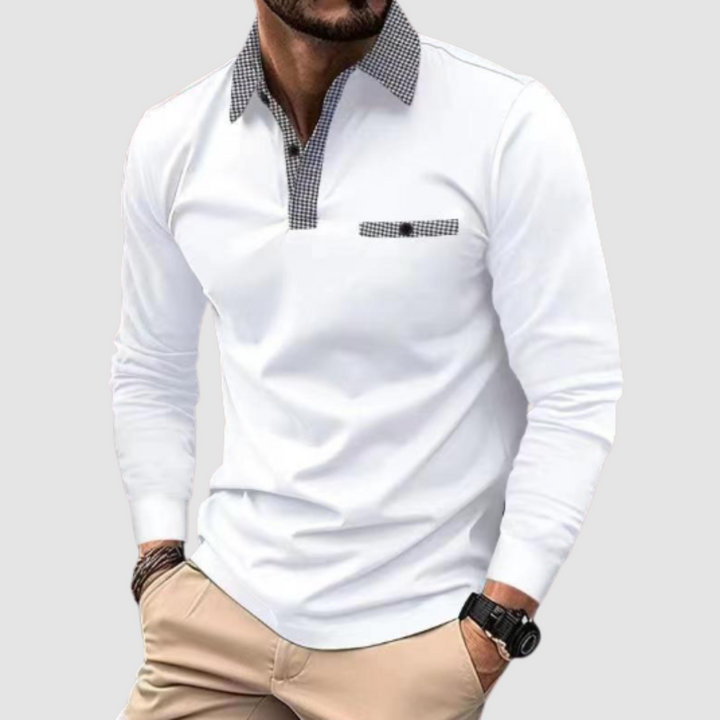 White long-sleeve polo shirt with houndstooth collar and pocket trim, worn by a person against a gray background.