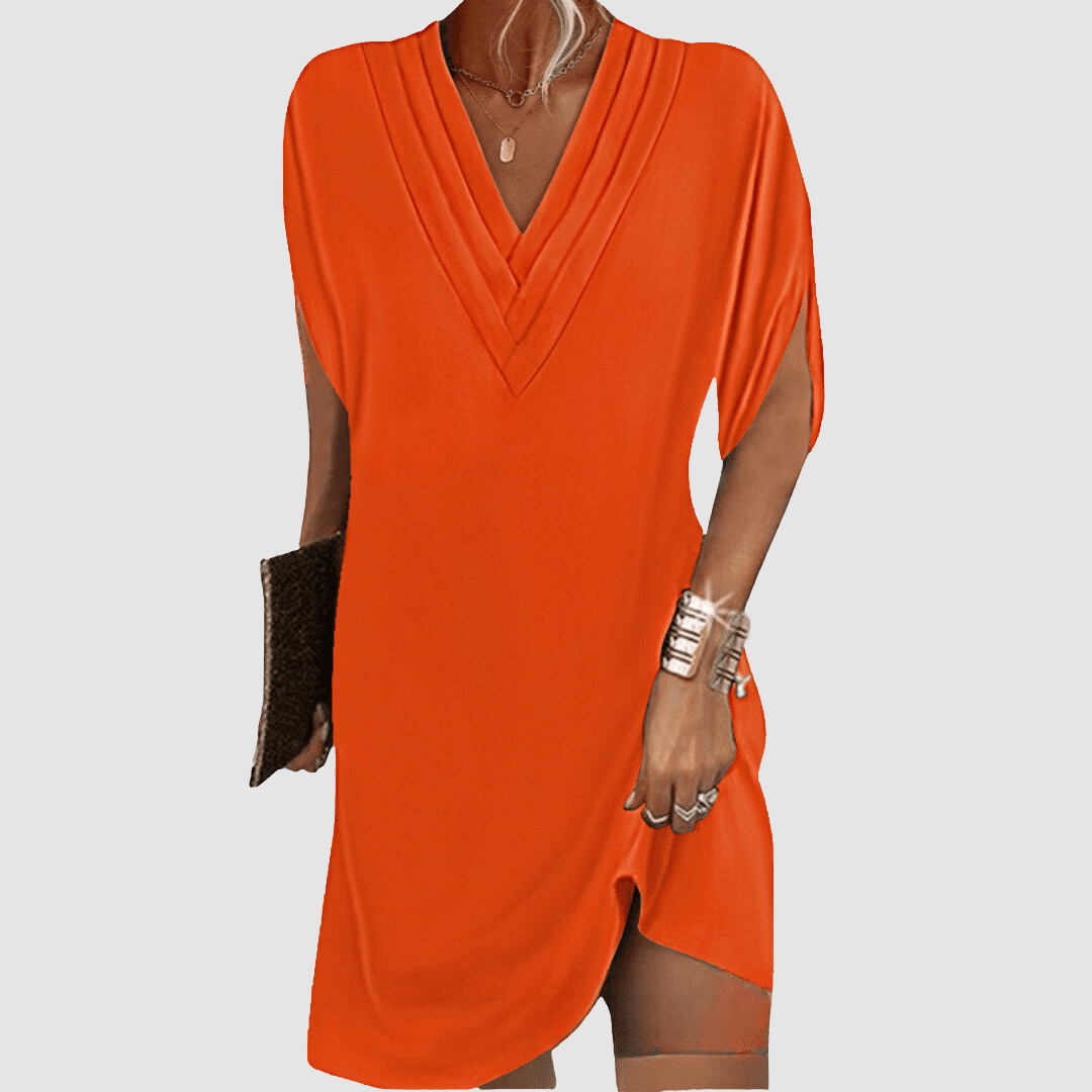 Vibrant orange half-sleeve dress with a sophisticated V-neck, on a light grey background.