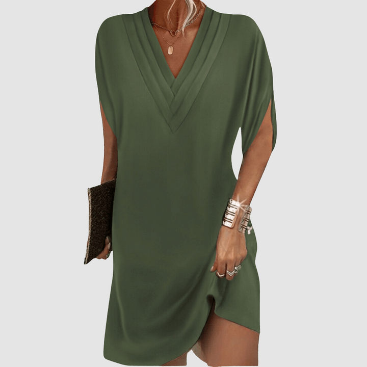 Elegant half-sleeve dress in dark green with V-neck design, showcased against a light grey background.