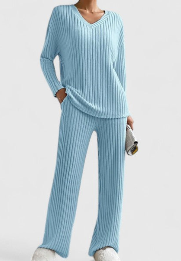 Light blue ribbed V-neck long-sleeve top and matching wide-leg pants in studio setting.