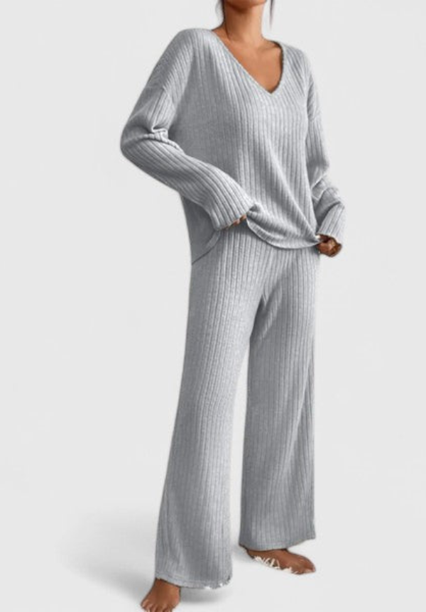 Gray ribbed V-neck long-sleeve top and matching wide-leg pants in studio setting.
