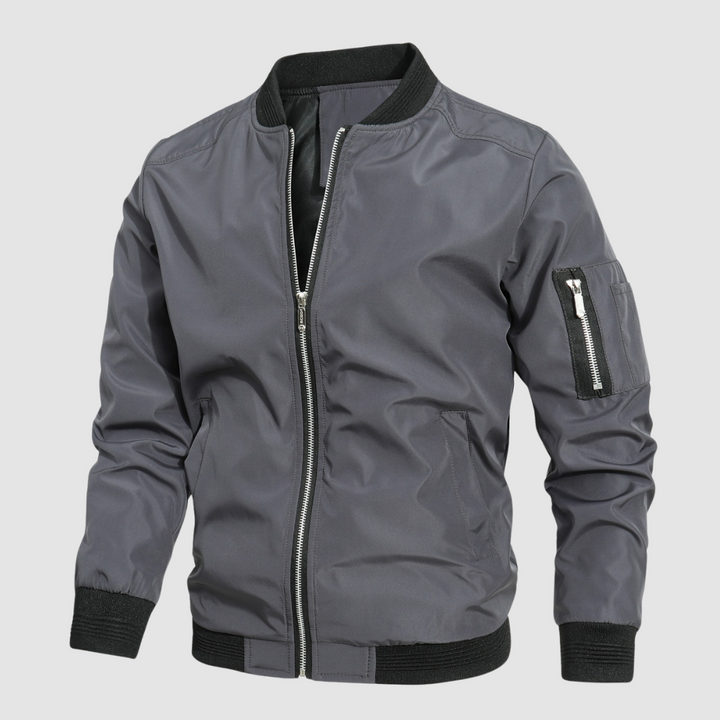 Gray lightweight bomber jacket with zipper front in a studio setting.