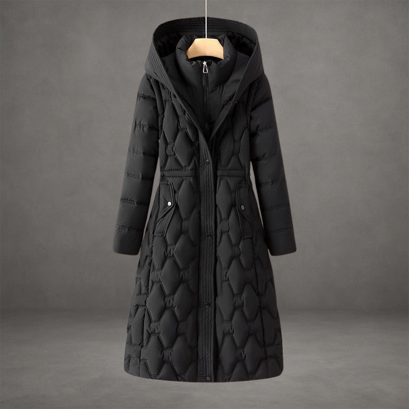 Elegant black coat with textured quilted pattern and hood in a studio setting.