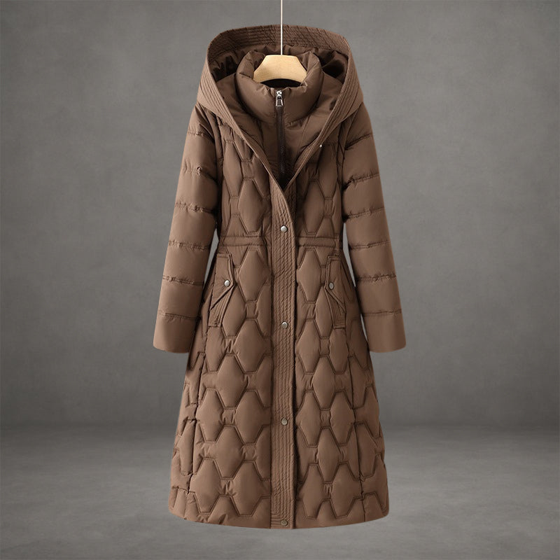 Elegant brown coat with textured quilted pattern and hood in a studio setting.
