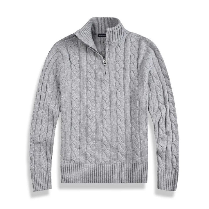 Gray cable-knit sweater with half-zip design, laid flat against a white background in a studio setting.