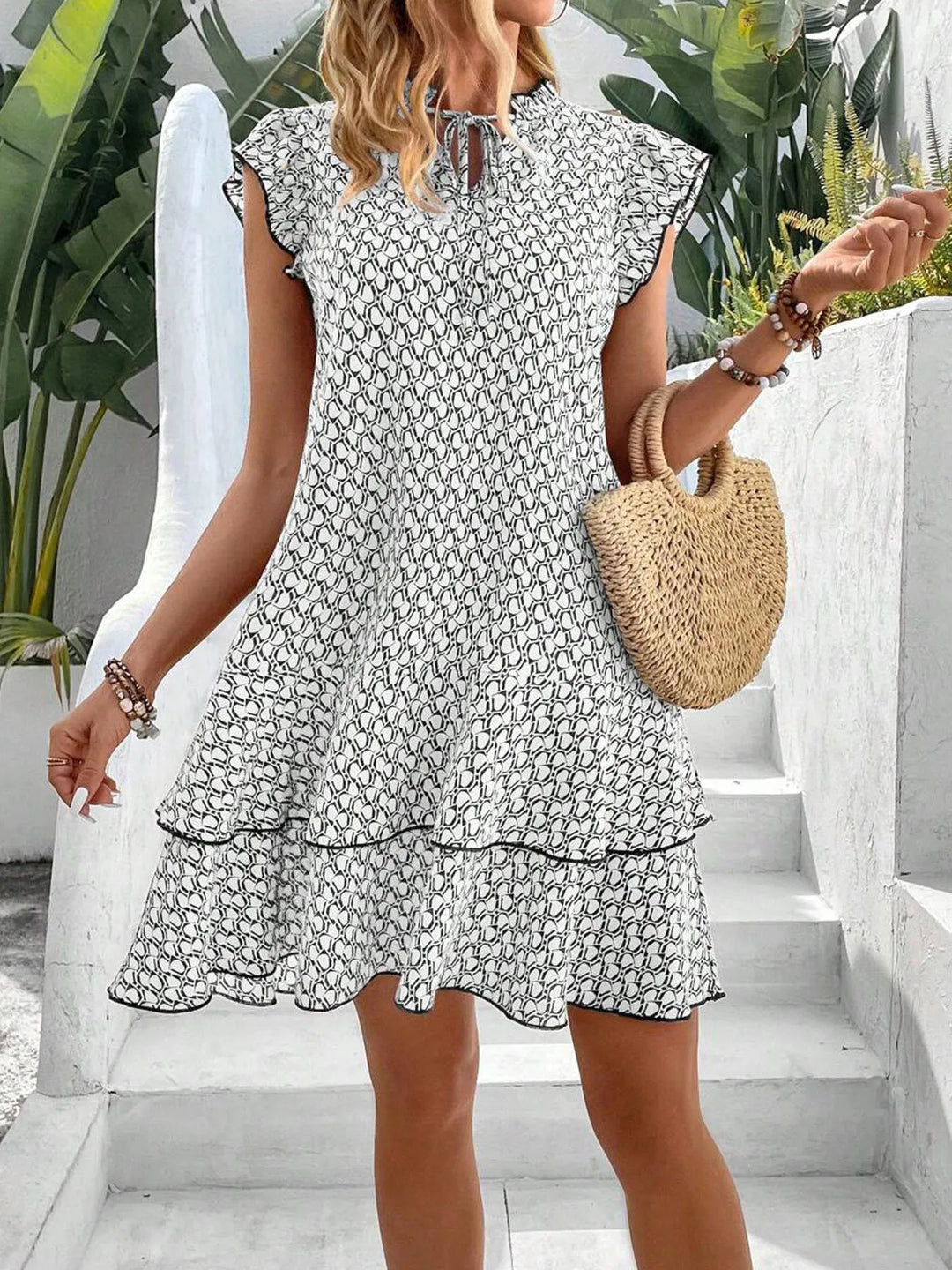 Krest – Printed Ruffle Mini Dress with Tie Neck