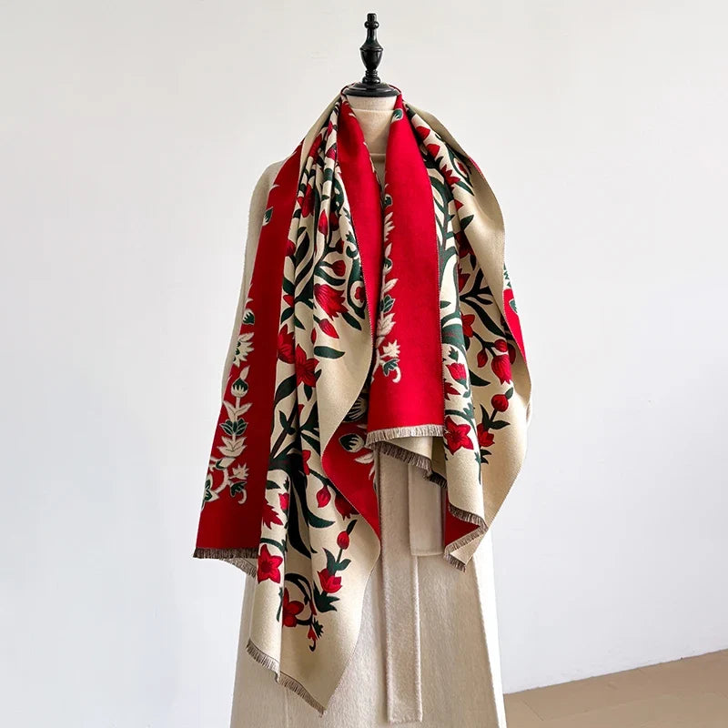 Red and cream floral scarf elegantly draped over a mannequin.