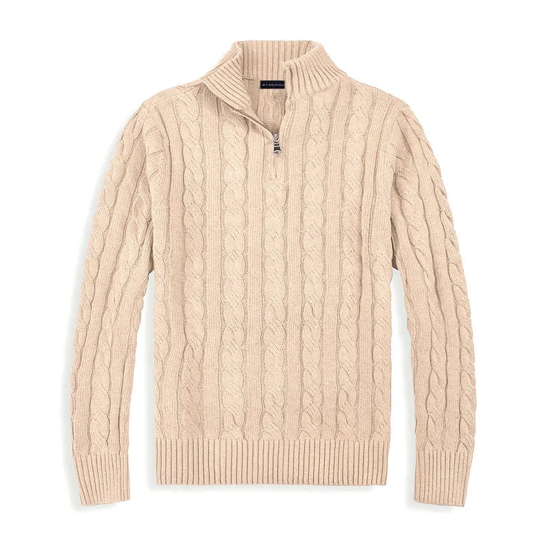 Beige cable-knit sweater with half-zip design, laid flat against a white background in a studio setting.
