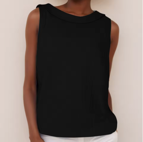 Black sleeveless top with roll collar on model, styled with white pants, set against a light background.