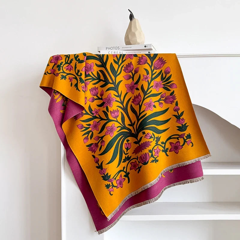 Botanical scarf with vibrant floral design draped over a white mantelpiece.