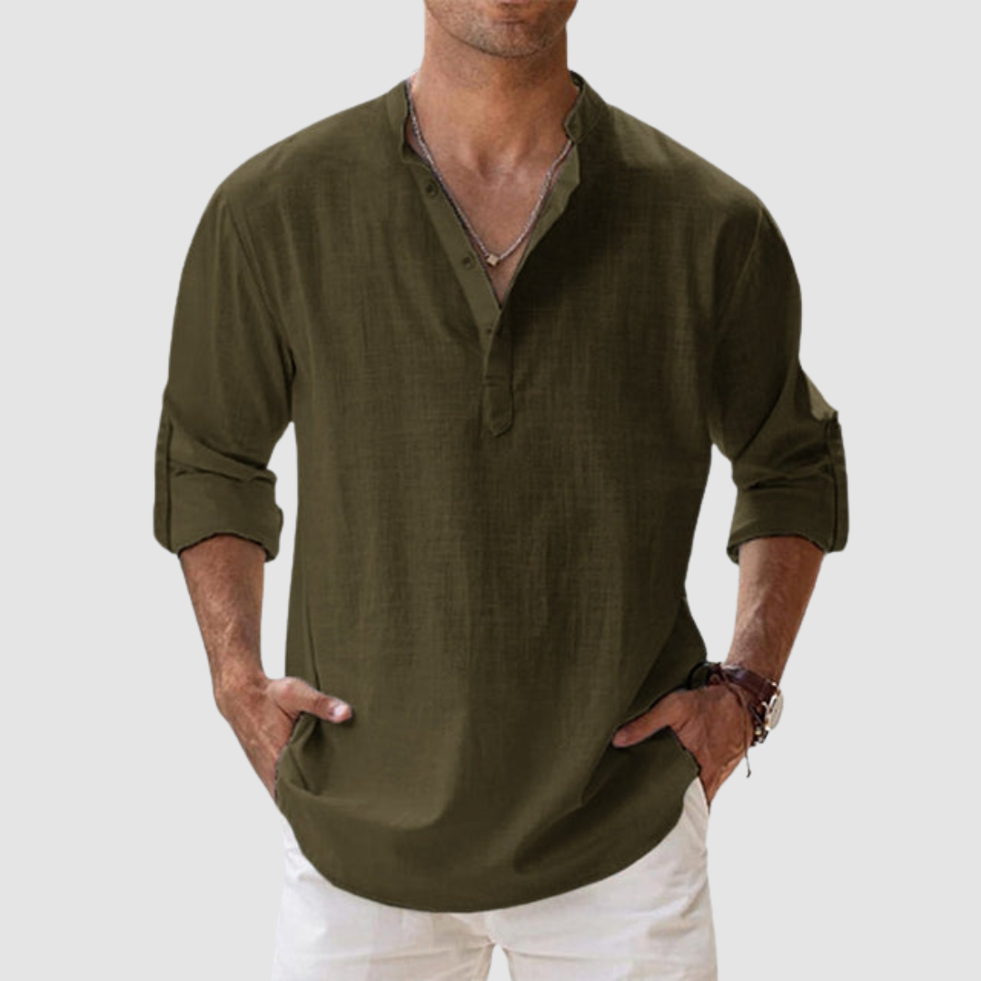 Dark green long-sleeve breathable shirt with banded collar, button placket, white pants in studio.