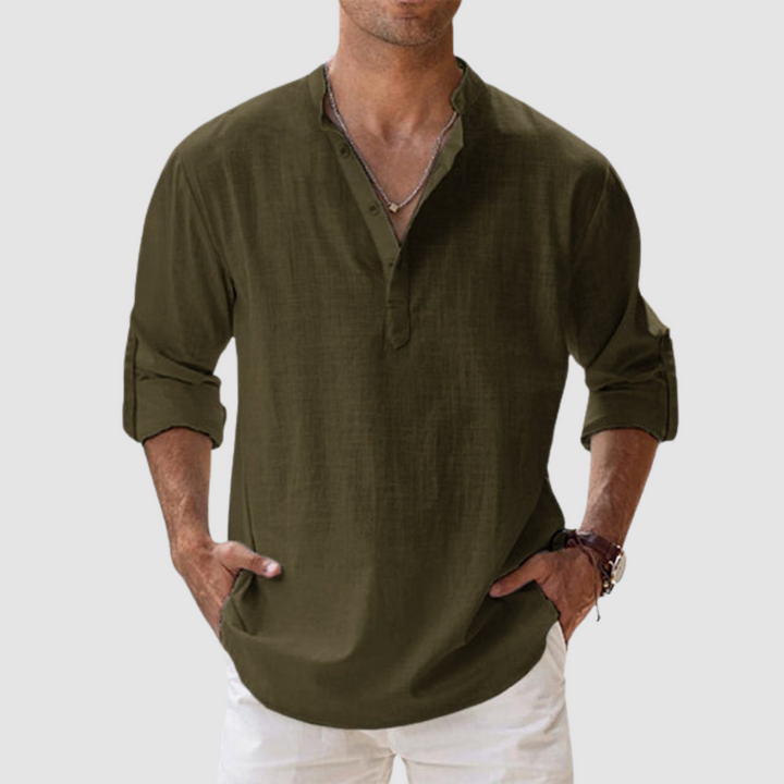 Dark green long-sleeve breathable shirt with banded collar, button placket, white pants in studio.