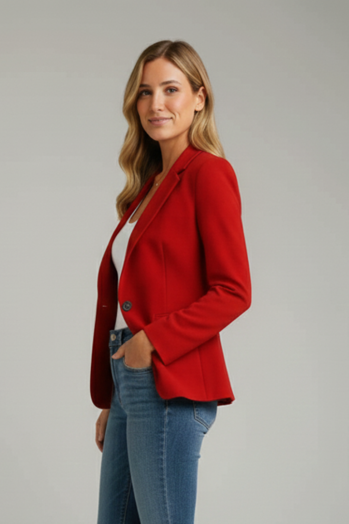 Side view of model in red blazer with notched lapel and jeans.