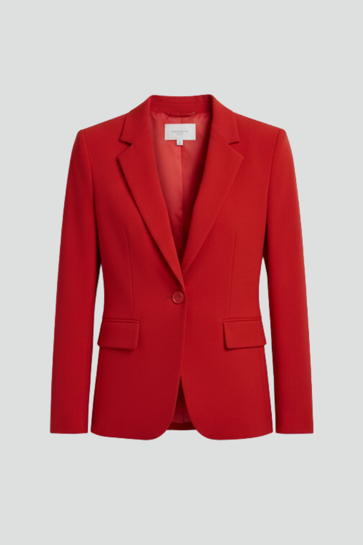 Red women’s blazer with notched lapel and single button in studio setting.