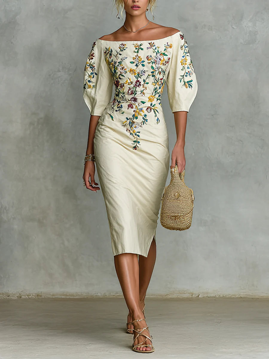 Off shoulder floral dress with puff sleeves, intricate embroidery in vivid colors; accessorized with a woven bag and strappy sandals, studio background.