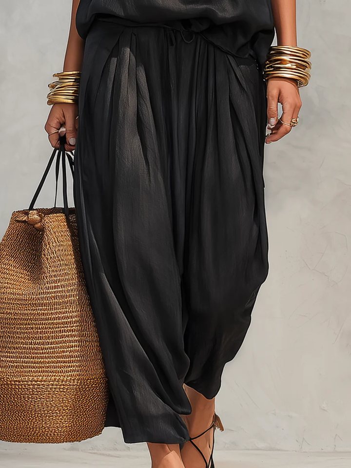 Focus on black two-piece set pants and woman&