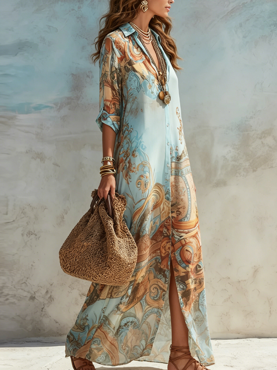 Side view of floral maxi dress with ornate design, accessorized with layered jewelry and a woven bag in a studio setting.