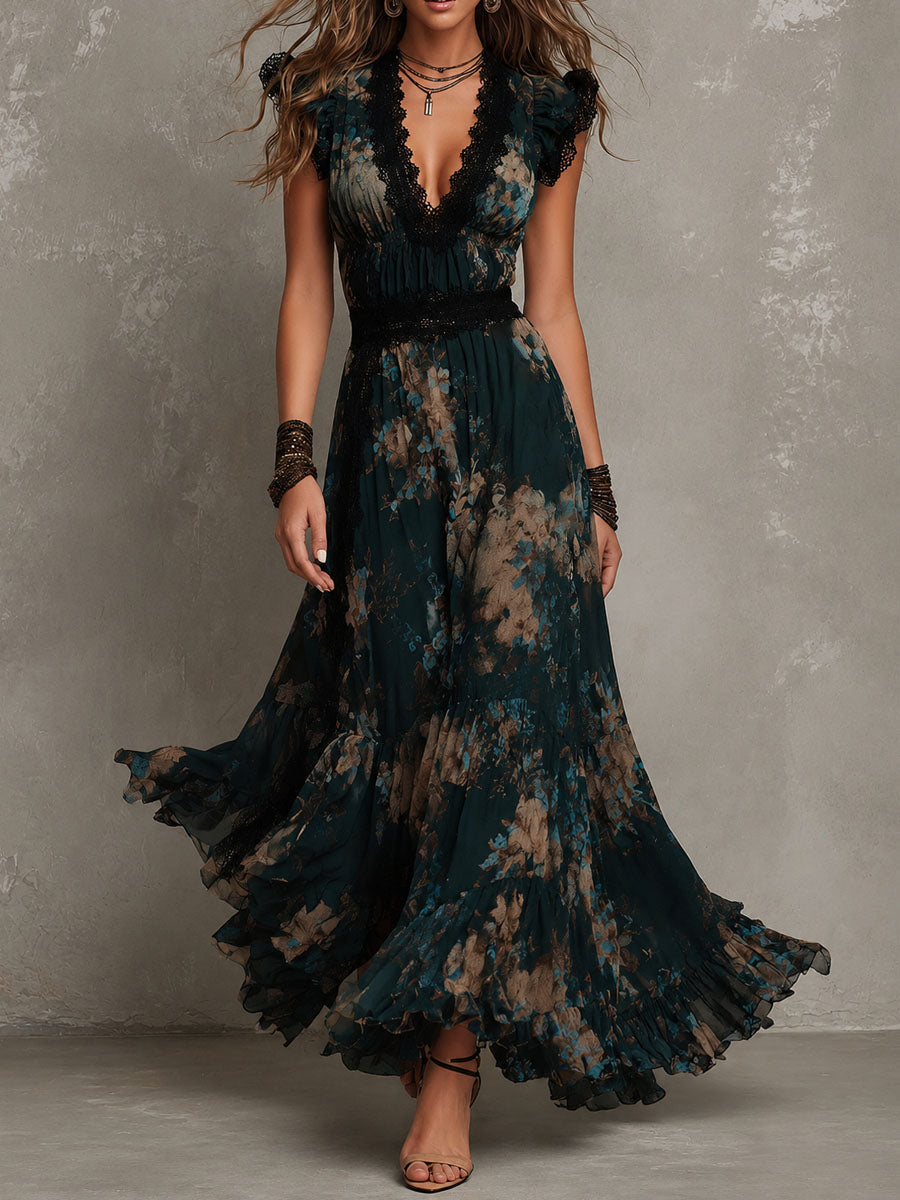 Flowing maxi dress in dark floral pattern, black lace trim, worn by model twirling in studio setting with gray background.