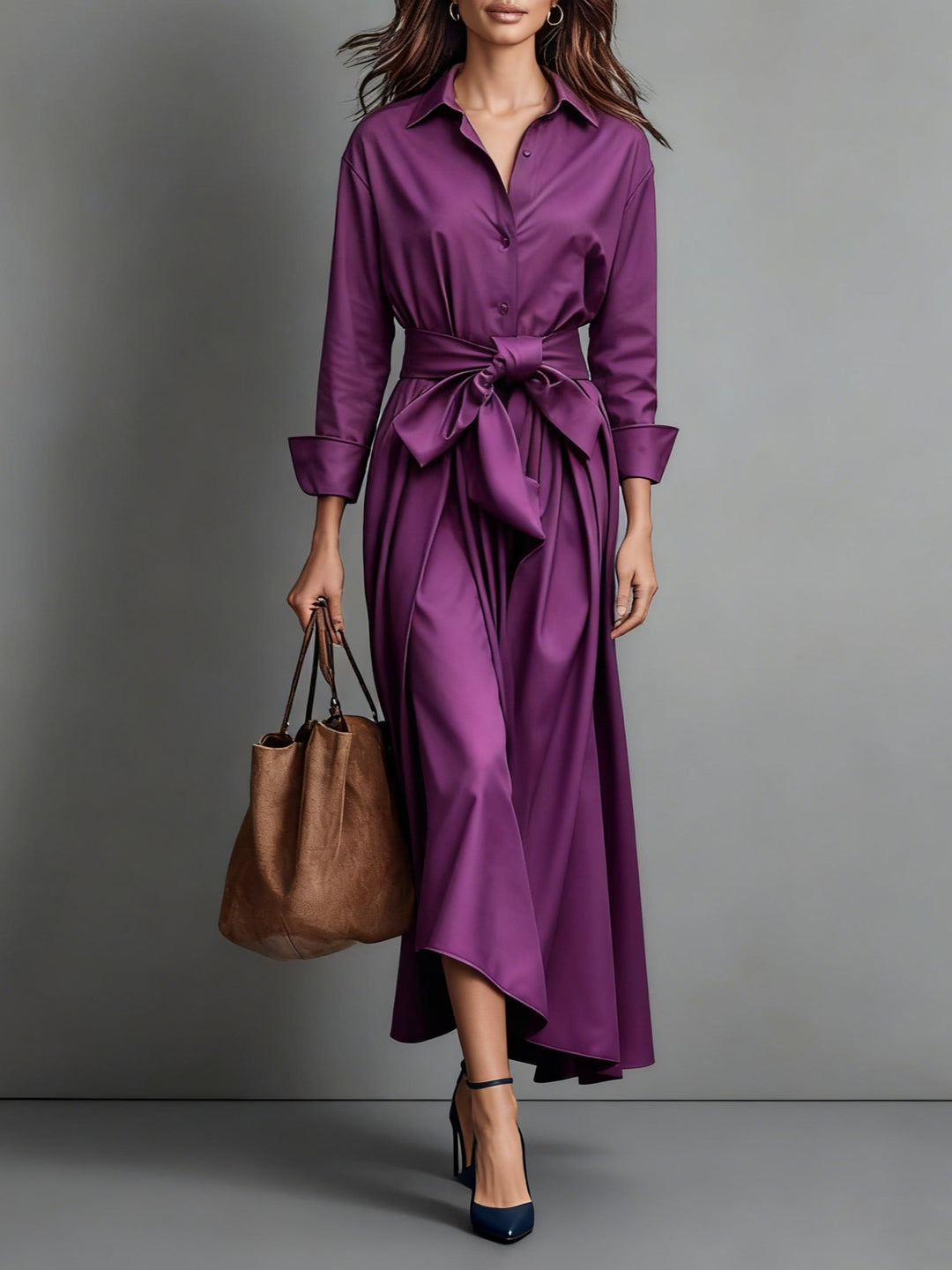Purple maxi dress with waist belt, long sleeves, paired with brown tote bag and navy heels in studio setting.