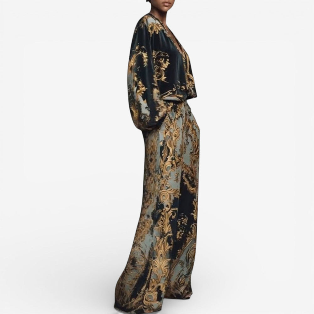 Side view of the elegant printed set showcasing voluminous sleeves and wide-leg pants in a baroque pattern, on a white background.