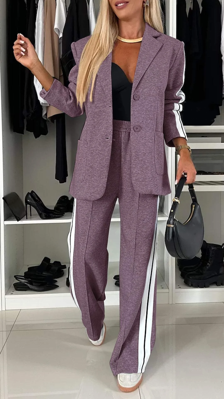 Purple casual office suit with white stripes, shown in a closet with black high heels.