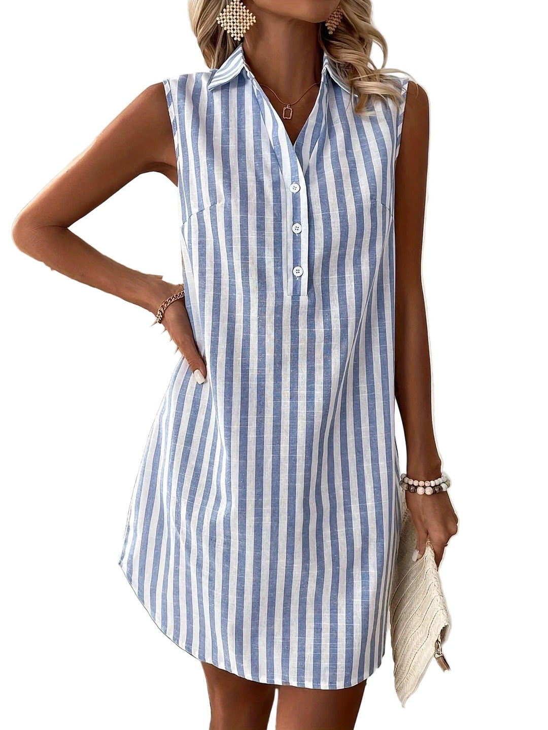 Sleeveless blue and white striped shirt dress worn by model holding a clutch against a white background.