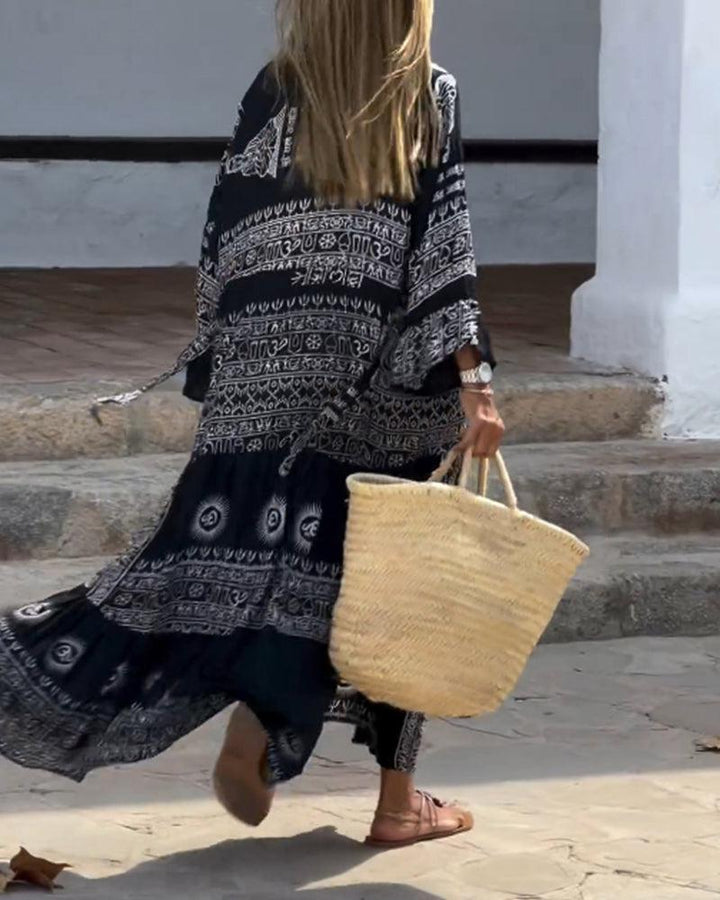 Emy – Printed Maxi Dress with V-Neck &amp; Bell Sleeves