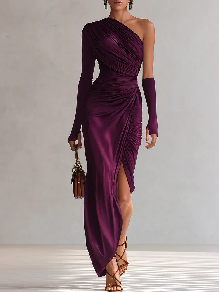 Elegant one-shoulder purple maxi dress with gloves, brown handbag, and strappy sandals in neutral studio setting.