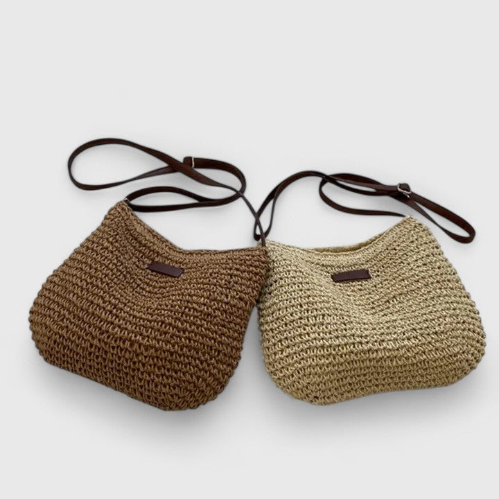 Pair of woven bags in brown and beige on a simple white background.